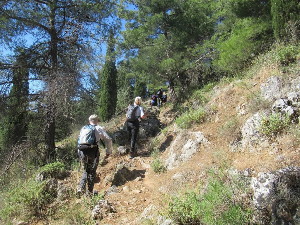 Guests trekking on a mountain trail in Crete
