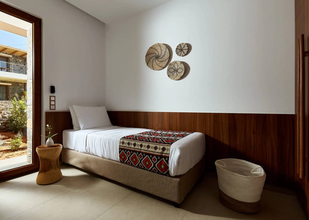 Bedroom with walnut panelling and woven wall plates