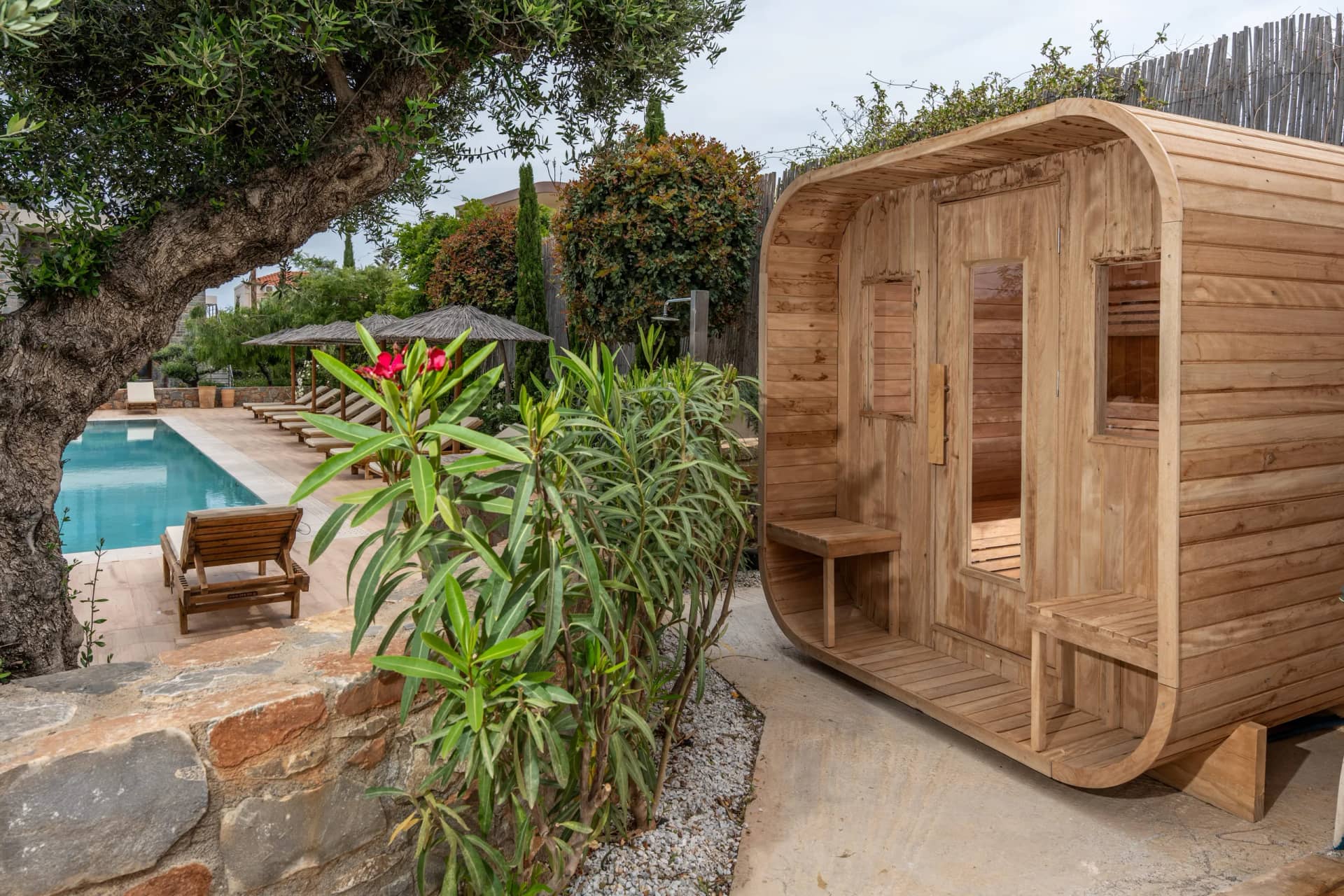 The traditional sauna beside the pool in the garden of Volta Suites and Villas
