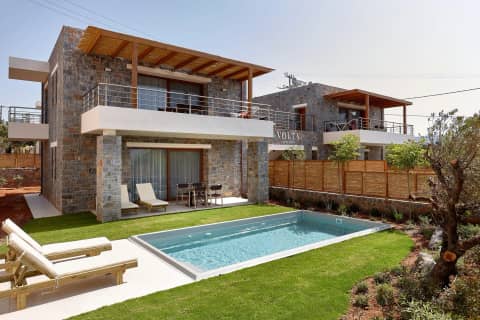 The four bedroom villa of Volta Suites and Villas with its private pool and stone facade in Kato Gouves, Crete